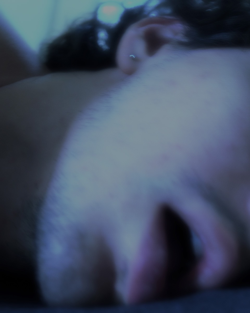 Blurry closeup of a man's open mouth. Eyes and nose are cropped out